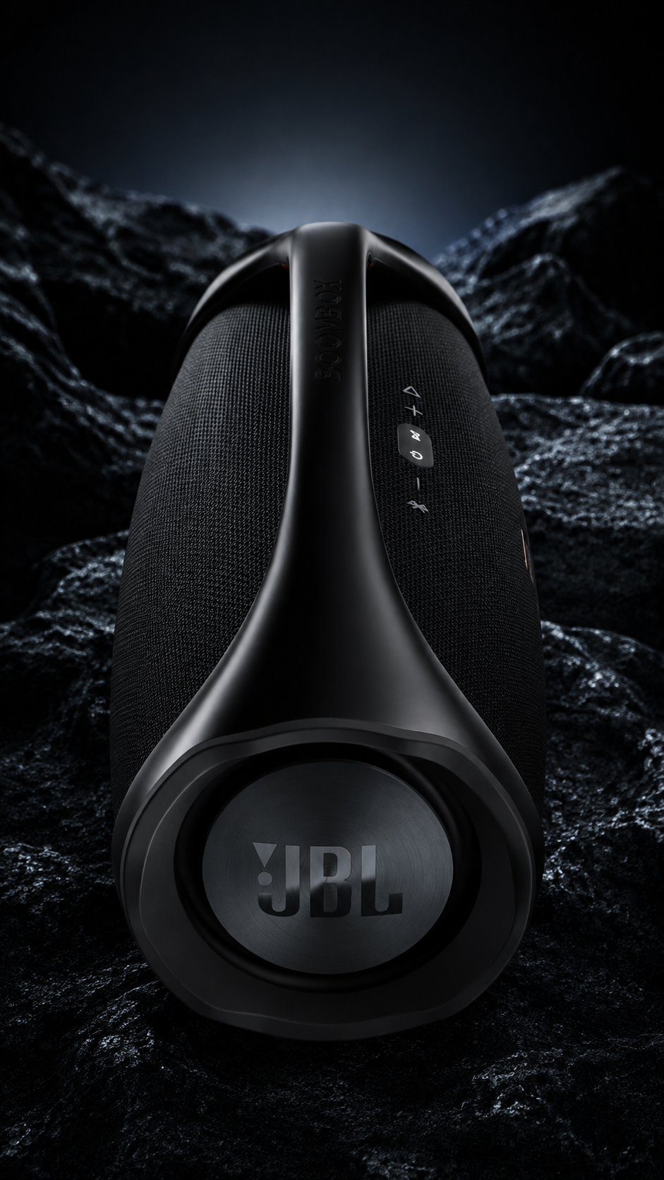 JBL BOOMBOX 3 — END-ON VIEW AMONG BLACK ROCKS