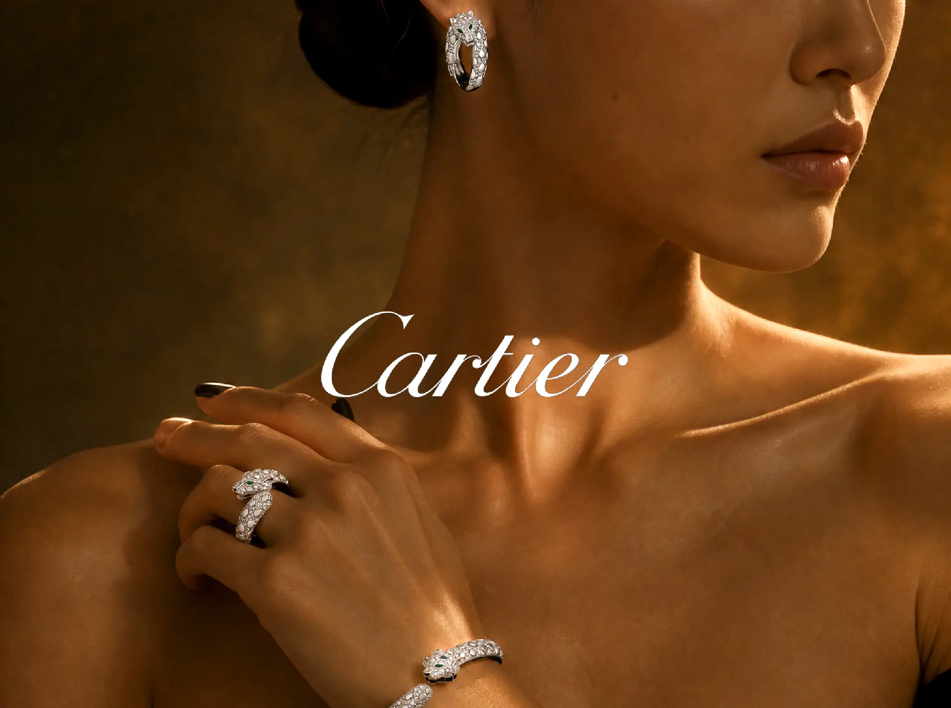 CARTIER — PANTHÈRE EARRING, RING AND BRACELET WORN IN PORTRAIT