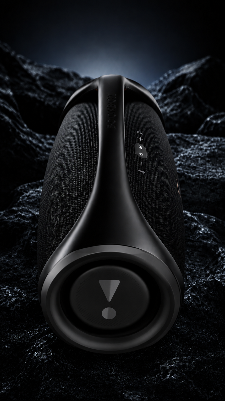 JBL BOOMBOX 3 — END-ON VIEW AMONG BLACK ROCKS